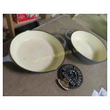 2 heavy cast pans and trivet good used condition