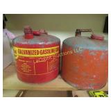 2 older metal gas cans