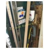 level rule clamp crow bar all on side of cabinet