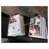assorted country cds in holders