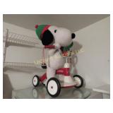 Plush Snoopy riding Radio flyer bike