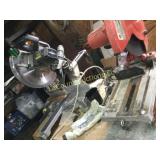 entire work bench with chop saws and shop vac