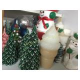 shelf of Christmas candles decor trees