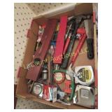 assorted tools pliers level tape measures more