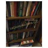 assorted books on shelf religious more