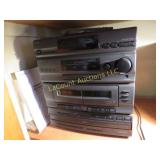 stereo system w speakers tape player remote