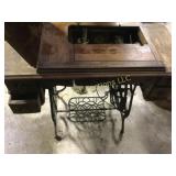 antique sewing machine in cabinet