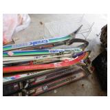 assorted down hill and cross country skiis boots