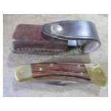 Buck pocket knife in leather case