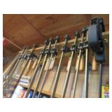 many assorted wood clamps