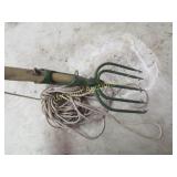 fishing spear w long rope attached fish frogs