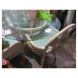 rattan glass top table w 4 padded chairs