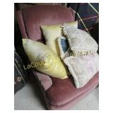 older rocking chair w throw pillows