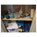 bottom 2 shelves bobble candles clothing misc