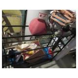 metal sporting good rack w contents roller skates