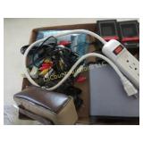 assorted electronics mini speakers power strip