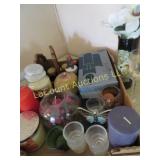 many assorted candles jars tapers holders
