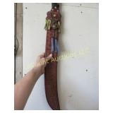 large machete in leather sheath