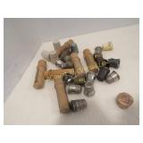assorted thimbles & needle holders corks