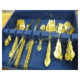 gold plated flatware set in wood storage chest