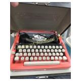 vintage Parade coral color typewriter in case