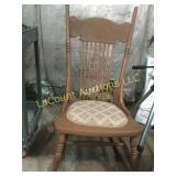 Antique rocking chair padded seat