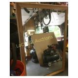 large wood framed mirror