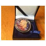 Colorized one dollar coin collector coin in case