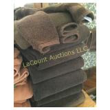 many plush brown bath towels hand wash cloths