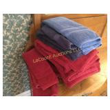 many plush red/ blue bath towels hand wash cloths