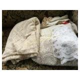 assorted lace table cloths doillies