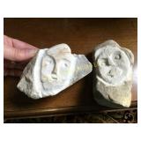 2 interesting carved face stones