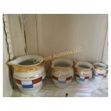 set of 4 vintage graduated smaller pitchers