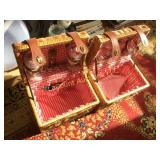 2 wicker picnic baskets with wine glasses