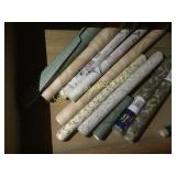 assorted wall paper rolls some unused
