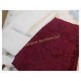 3 tablecloths, 2 white, 1 burgundy