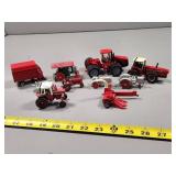 Small Red Die-Cast Toy Tractors and Implements