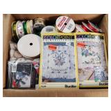 Crafting Supplies Including Pom-Poms and Ribbon