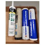 Tubes of Grease and Caulk