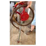 Red Cast-Iron Hand Pump with Metal Handle and Base