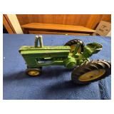 Small John Deere Die-Cast Toy Tractor with Bent Ax
