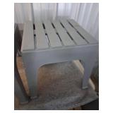 Two Plastic Tables and a Wire Trash Can