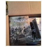 4 Boxes of DVDs Featuring Historical, War, and Pop