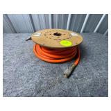 Heavy-Duty Orange Air Hose on Wooden Spool with Co