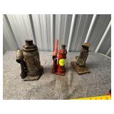 Three Metal Hydraulic Floor Jacks, One with Handle