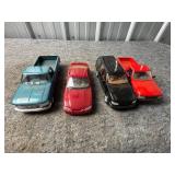 Four Plastic Model Vehicles Including Trucks and C