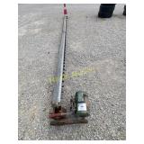 Grain bin sweep auger with motor