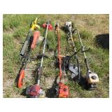 group of weed whackers and blower