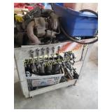 Mechanic cart full of parts, some wrenches