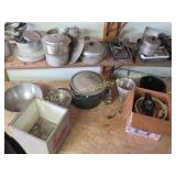 kitchen items on shelf and floor under the shelf